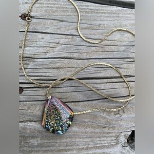 Metallic-looking necklace.